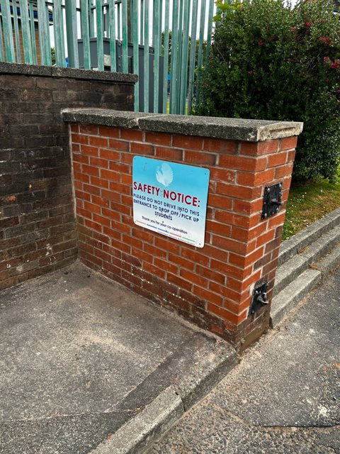 Rebuilt brick gate pier